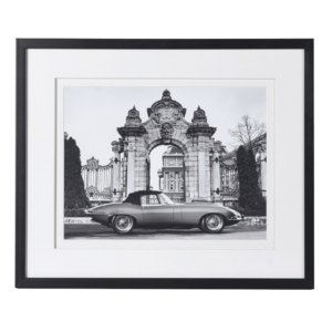 The classic picture featuring the iconic 1968 Jaguar car in a French chateaux setting ibn black 6 white, black framed in passe partout Measurements: H:48 W:58 cm
